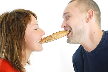 Image showing happy couple eating croissant
