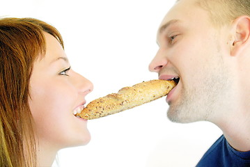 Image showing happy couple eating croissant