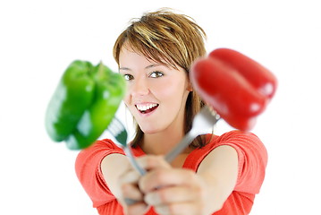 Image showing pretty girl with pepper isolated