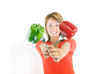 Image showing pretty girl with pepper isolated