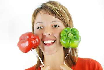 Image showing pretty girl with pepper isolated