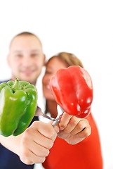 Image showing  happy couple with peppers isolated