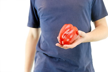 Image showing happy couple holding peppers with head