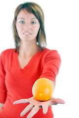 Image showing happy girl with orange in hand