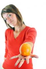 Image showing happy girl with orange in hand