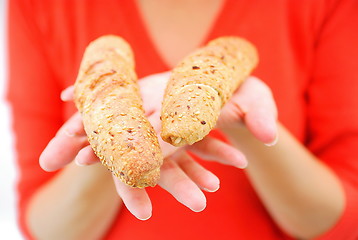 Image showing fresh croissant in woman hand