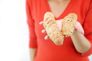 Image showing fresh croissant in woman hand