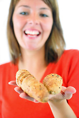 Image showing fresh croissant in woman hand