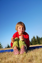 Image showing happy girl eating healthy food in nature