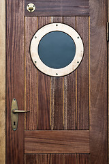 Image showing Old ship door with a window