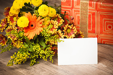 Image showing  giftbox and a bouquet of flowers 