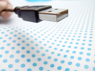 Image showing usb cable on dotted background