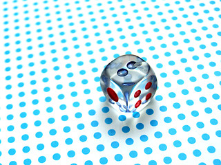 Image showing gamblig dice on blue dotted background