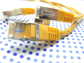 Image showing yellow ethernet cable on dotted background