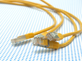 Image showing yellow ethernet cable on dotted background