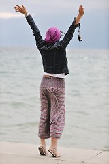 Image showing beautiful young woman on beach with scarf