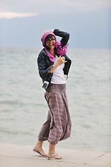 Image showing beautiful young woman on beach with scarf