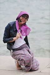 Image showing beautiful young woman on beach with scarf