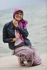 Image showing beautiful young woman on beach with scarf