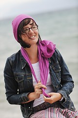 Image showing beautiful young woman on beach with scarf