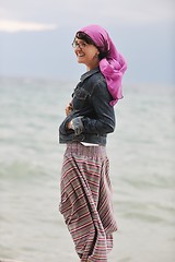 Image showing beautiful young woman on beach with scarf