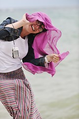 Image showing beautiful young woman on beach with scarf