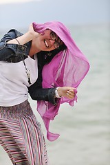 Image showing beautiful young woman on beach with scarf