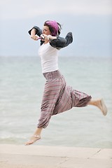 Image showing beautiful young woman on beach with scarf