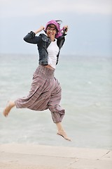 Image showing beautiful young woman on beach with scarf