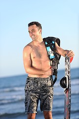 Image showing Portrait of a young  kitsurf  man at beach on sunset