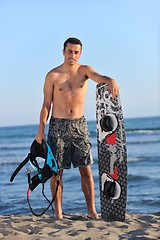 Image showing Portrait of a young  kitsurf  man at beach on sunset