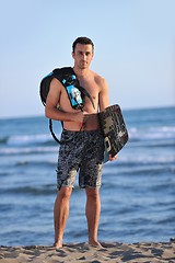 Image showing Portrait of a young  kitsurf  man at beach on sunset