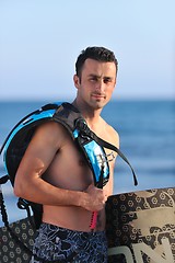 Image showing Portrait of a young  kitsurf  man at beach on sunset