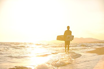 Image showing Portrait of a young  kitsurf  man at beach on sunset