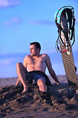 Image showing Portrait of a young  kitsurf  man at beach on sunset