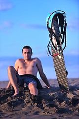 Image showing Portrait of a young  kitsurf  man at beach on sunset