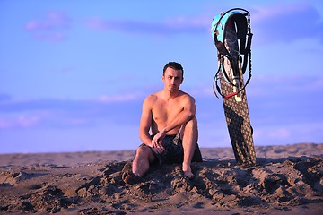 Image showing Portrait of a young  kitsurf  man at beach on sunset