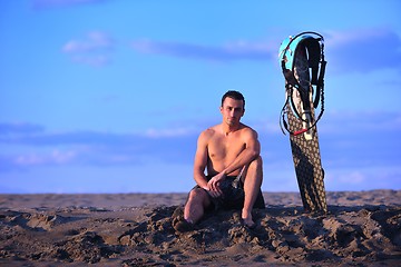 Image showing Portrait of a young  kitsurf  man at beach on sunset