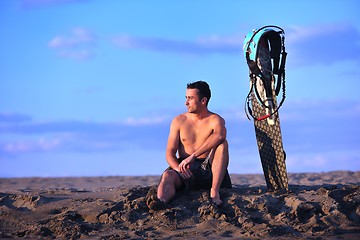 Image showing Portrait of a young  kitsurf  man at beach on sunset