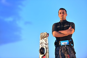 Image showing Portrait of a young  kitsurf  man at beach on sunset