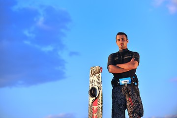 Image showing Portrait of a young  kitsurf  man at beach on sunset