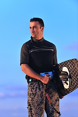 Image showing Portrait of a young  kitsurf  man at beach on sunset