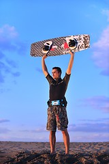 Image showing Portrait of a young  kitsurf  man at beach on sunset