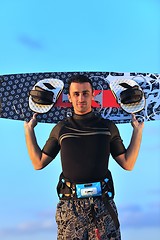 Image showing Portrait of a young  kitsurf  man at beach on sunset