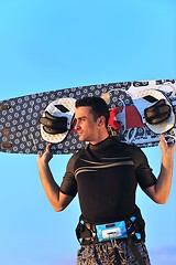 Image showing Portrait of a young  kitsurf  man at beach on sunset