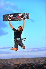 Image showing Portrait of a young  kitsurf  man at beach on sunset