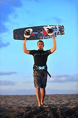 Image showing Portrait of a young  kitsurf  man at beach on sunset