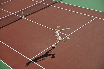 Image showing young woman play tennis outdoor