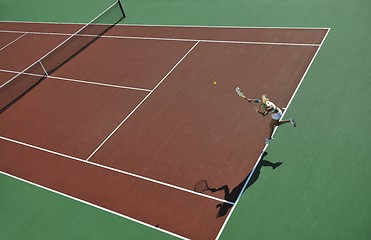 Image showing young woman play tennis outdoor