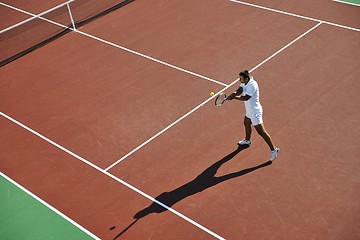 Image showing young man play tennis outdoor